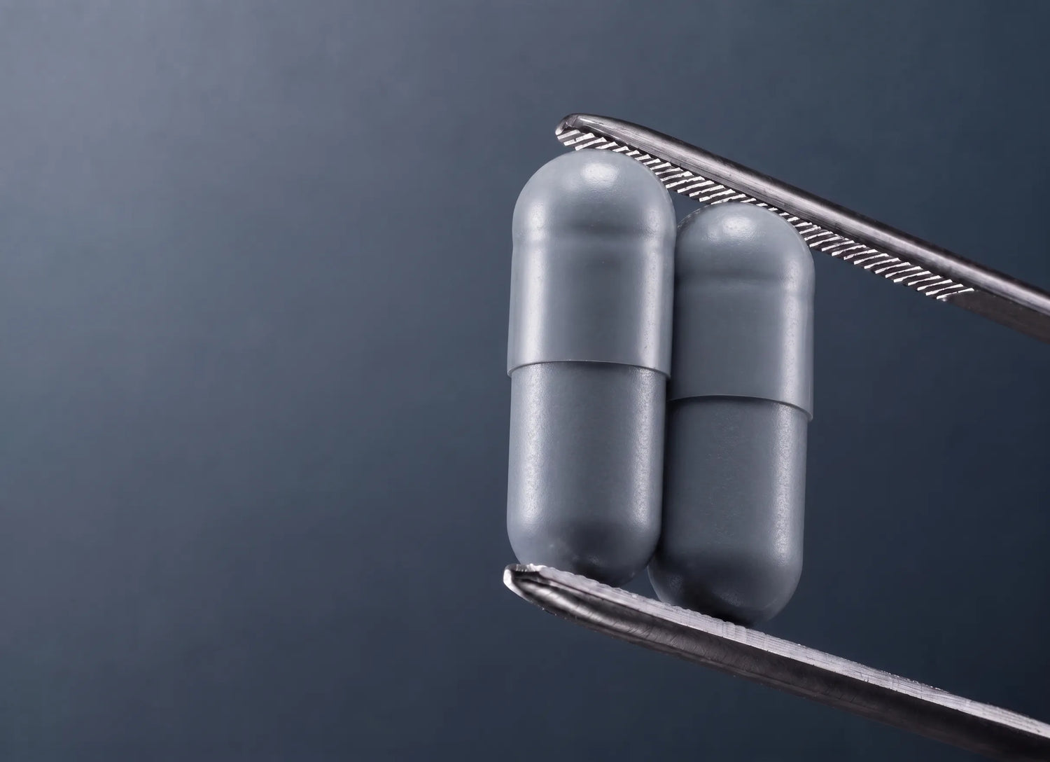 Creatine powder being scooped into a glass of water